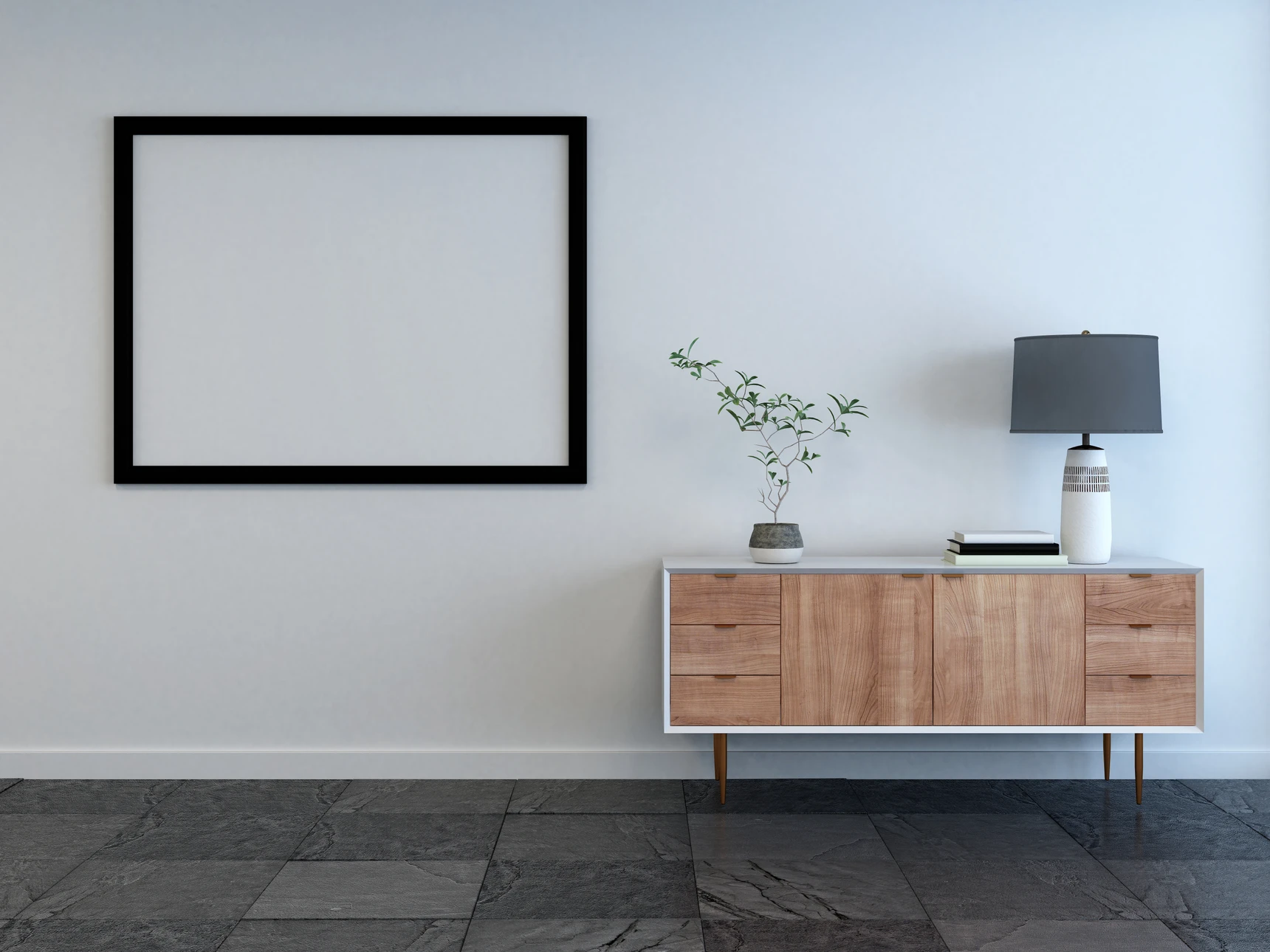 Intérieur minimaliste moderne avec meuble bas en bois sur pieds compas, mur blanc, cadre noir vide, luminaire contemporain et plante décorative